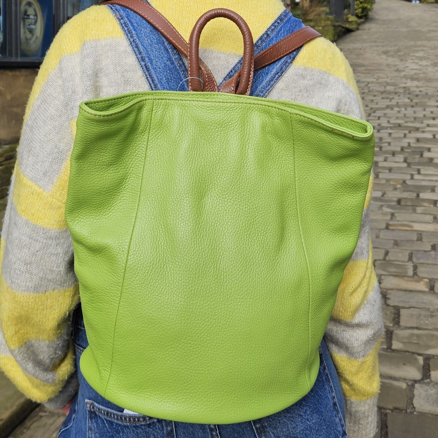 Discover the perfect blend of style and convenience with this Italian leather postman's lock backpack! Its sumptuous, pebbled leather offers timeless sophistication and makes a bold statement wherever you go. Keep your belongings safe and secure with both the postman's lock and zip closure. And with its spacious design, you'll have plenty of room to store your everyday essentials.