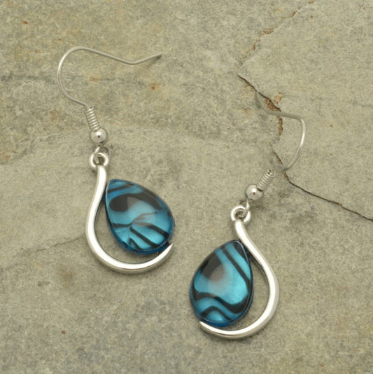 These stunning turquoise and silver earrings are sure to turn heads! Crafted with a unique and eye-catching curved drop design, the resin-style is elegantly emphasized by a mother of pearl shell effect paper backing for an extra touch of depth. Make a statement with an unforgettable accessory!  The earrings drop approximately 1.5cm from the base of fishhooks.