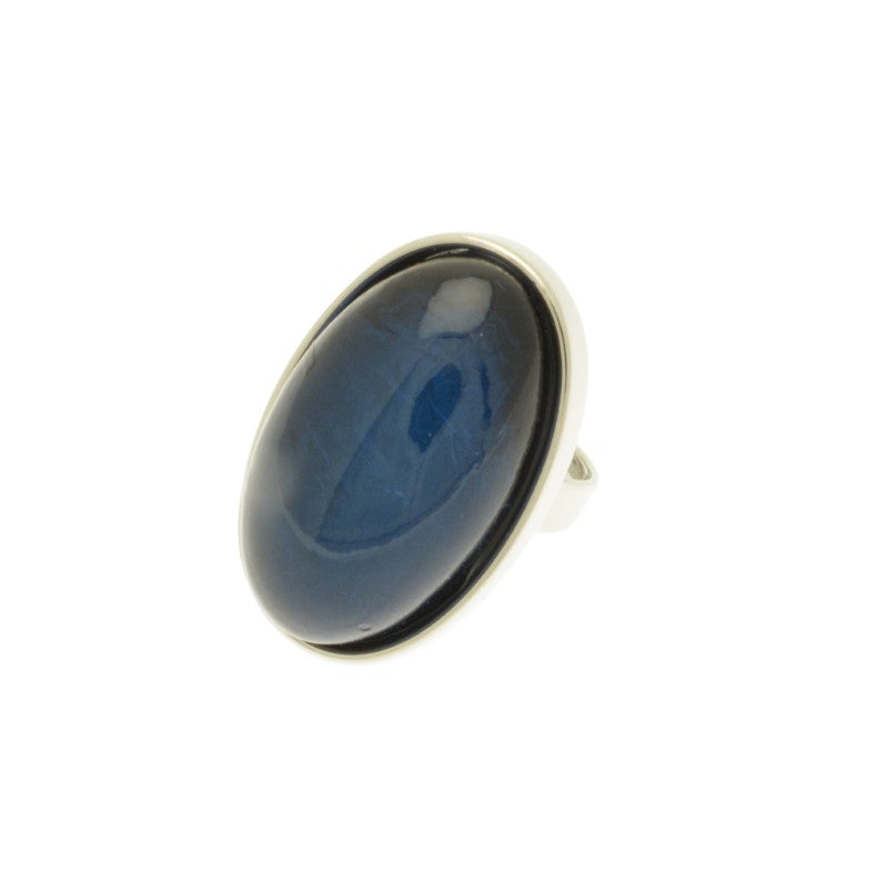 This Chunky Blue Foil Resin Adjustable Ring is the perfect addition to any jewelry collection. It boasts an eye-catching  blue color and a magnificent iridescent resin, adding an opalescent effect. Stylish and unique, it will coordinate with other Miss Milly jewellery and is adjustable for your convenience. Its dimensions are 3.3cm long by 2cm wide. Make a stylish statement with this beautiful ring!