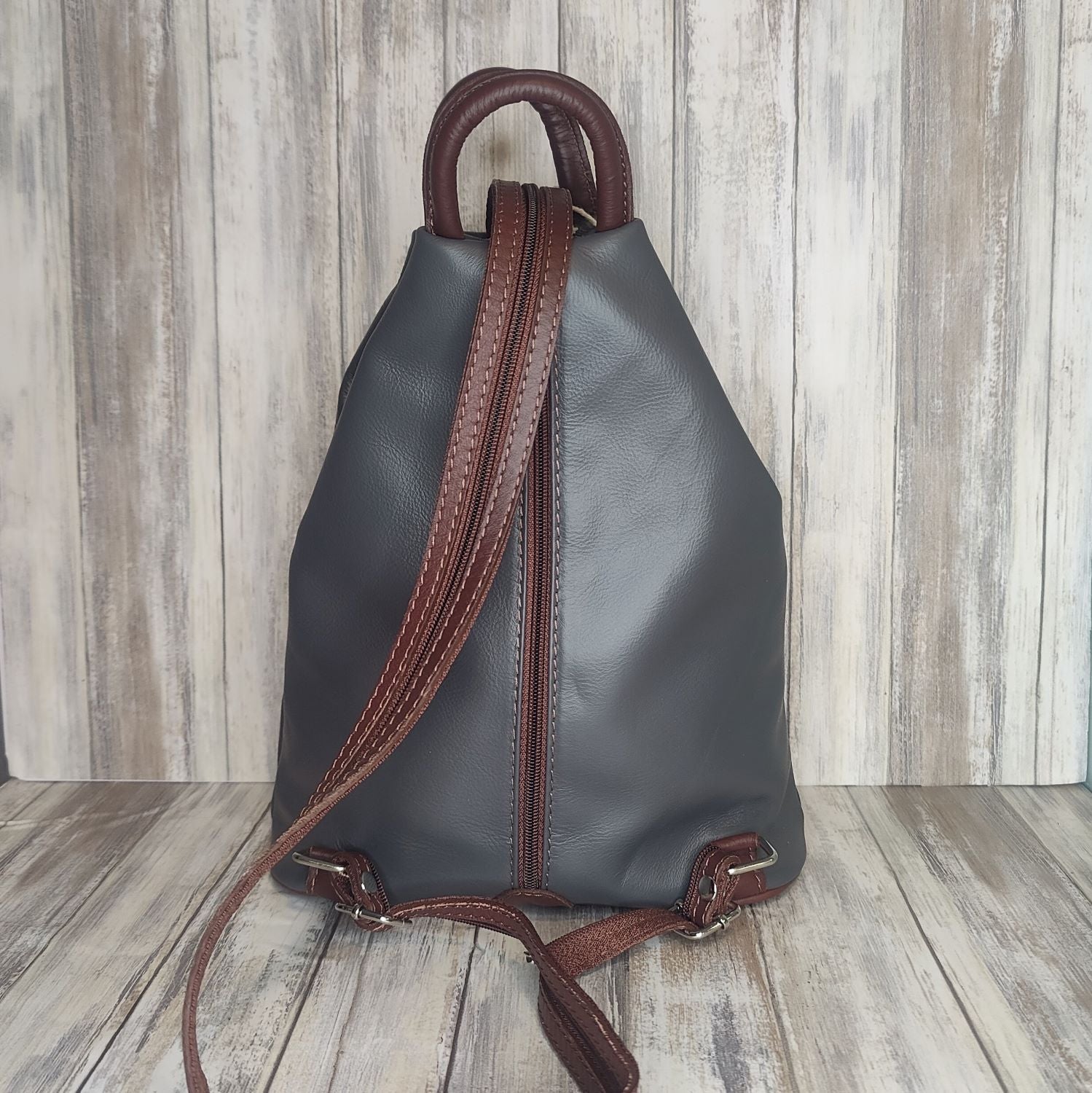A beautiful soft and lightweight leather Italian backpack. These versatile backpacks can be carried in three ways, either by the loop handle at the top, over one shoulder, or by unzipping the strap and wearing as a classic backpack. Each bag is fully lined and comes in such a variety of gorgeous colours so you won't have any trouble choosing your favourite!  Front, back and inside pockets.   w25cm x h31cm x d14 cm 