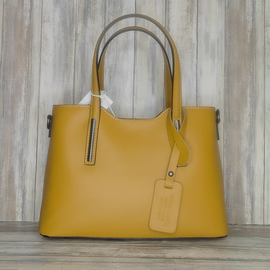 Elevate your style with this stunning Italian leather double compartment handbag.  Its soft yet structured design looks beautiful and feels equally beautiful to wear. This is a classic design that will match with any outfit and is the perfect size for all your essential items. Get ready to make a statement with this fashionable and functional addition to your wardrobe.  We love this bag!