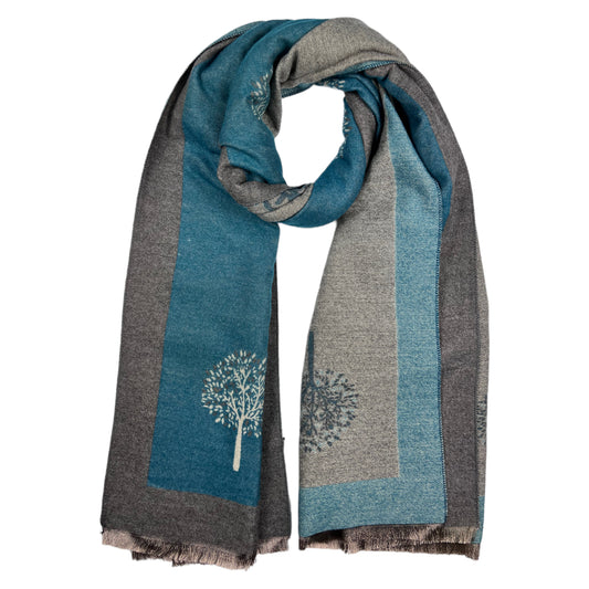 This beautiful, reversible scarf is crafted from a luxurious cashmere blend, featuring a striking teal hue and elegantly finished with tassels. The  tree of life print adds a sophisticated touch to this timeless piece, making it a perfect cozy addition to your look.     80% Viscose, 20% Cashmere  L: 180cm x W: 65cm (L: 71 inch x B:25.6inch)
