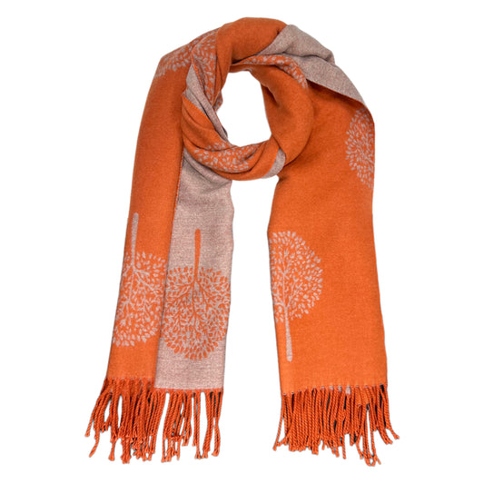This luxurious tree of life scarf is sure to make a fashion statement. Made from a luxuriously soft cashmere blend, the print is reversible and features delicate tassels for an elegant finishing touch. The gorgeous orange hue adds a vibrancy that will bring any ensemble to life.    80% Viscose, 20% Cashmere  L: 180cm x W: 65cm (L: 71 inch x B:25.6inch)