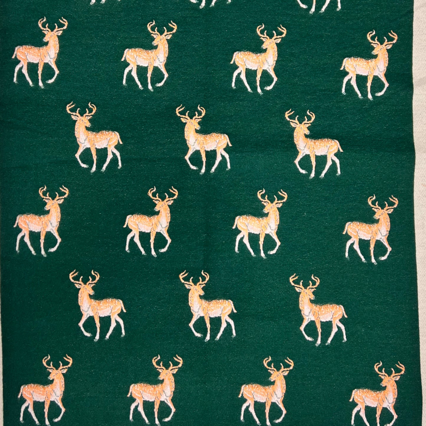 This reversible scarf is crafted from a luxurious cashmere blend and features a beautiful deer embroidered print. The perfect accessory to transition between seasons, it provides warmth and style for any occasion.     80% Viscose, 20% Wool  L: 180cm x W: 75c