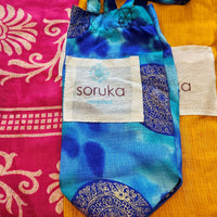 This Soruka Clutch/ Cross Body Bag is a classic, stylish accessory made from soft leather and animal print. This is a beautifully versatile bag with a top zip and popper closure, an outside zip pocket as well as an inside pocket. This is a perfect day to night accessory!  Each Soruka bag and large purse comes to you in a beautiful recycled Sari gift bag.  L:24cm x H:17cm