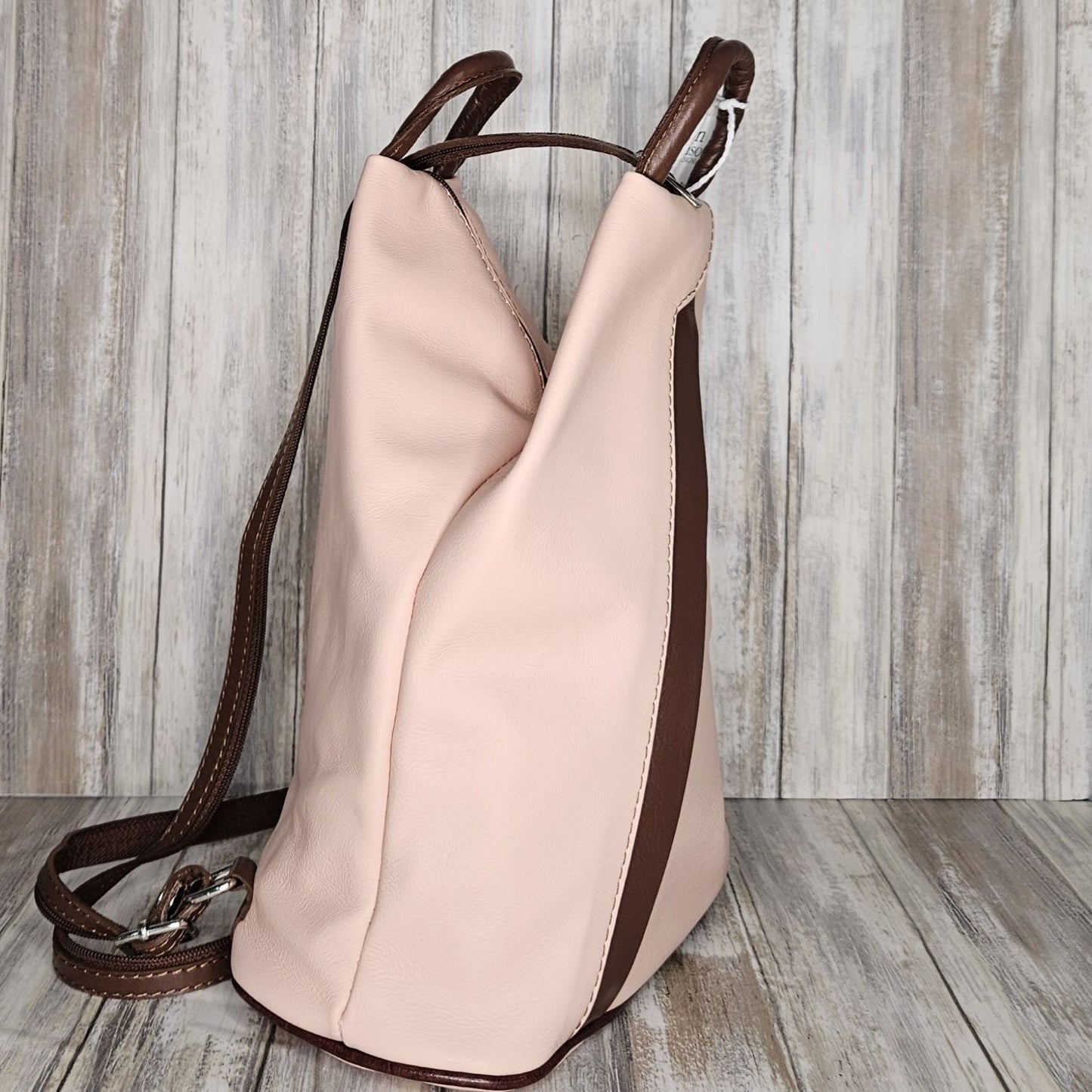 A beautiful soft and lightweight leather Italian backpack. These versatile backpacks can be carried in three ways, either by the loop handle at the top, over one shoulder, or by unzipping the strap and wearing as a classic backpack. Each bag is fully lined and comes in such a variety of gorgeous colours  you won't have any trouble choosing your favourite!      Front, back and inside pockets.   W:25cm x H:31cm x D:14cm 