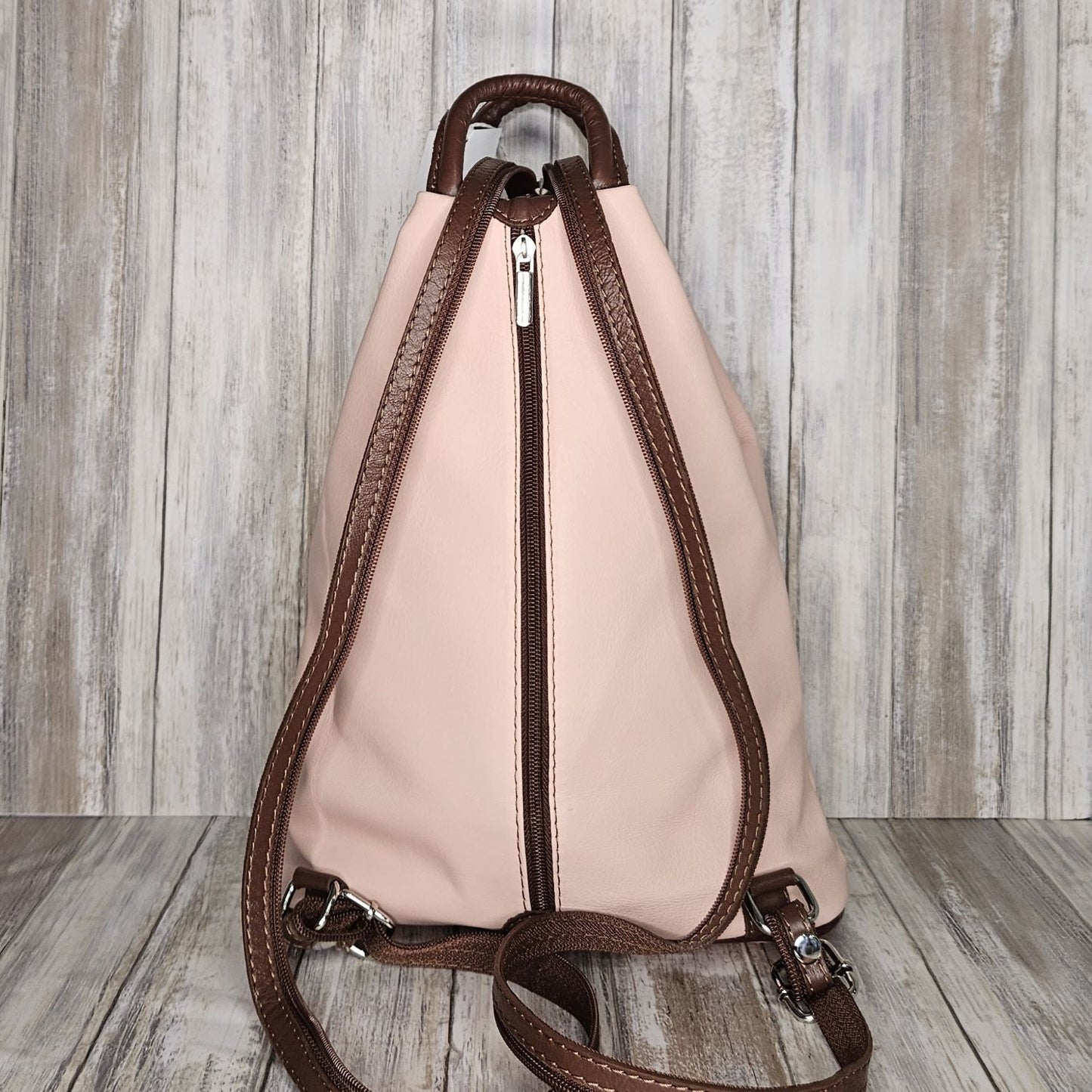 A beautiful soft and lightweight leather Italian backpack. These versatile backpacks can be carried in three ways, either by the loop handle at the top, over one shoulder, or by unzipping the strap and wearing as a classic backpack. Each bag is fully lined and comes in such a variety of gorgeous colours  you won't have any trouble choosing your favourite!      Front, back and inside pockets.   W:25cm x H:31cm x D:14cm 