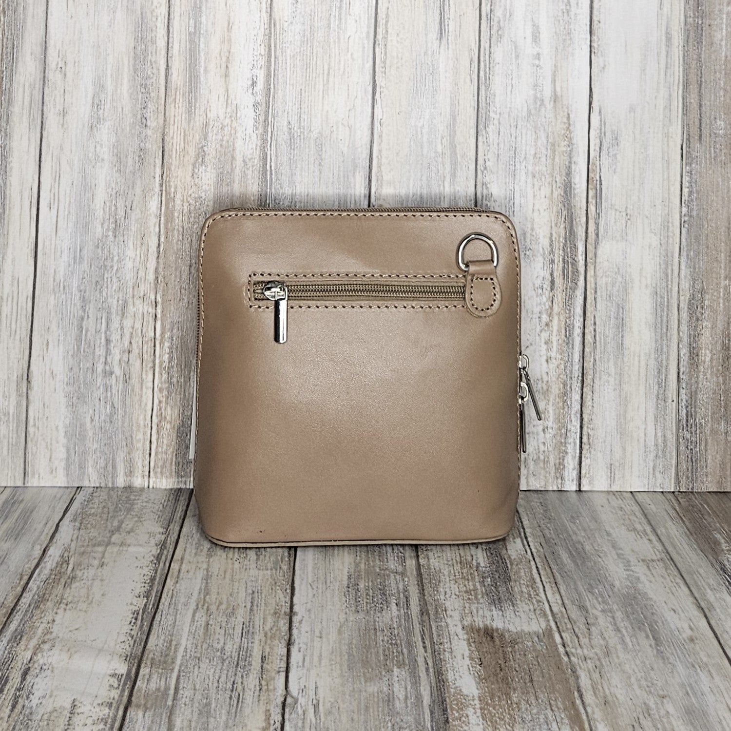 This stylish messenger bag is the ideal companion for your day-to-night looks, featuring detachable straps for easy transitions. Fully lined for convenience, a central zip compartment and an external zip pocket provide ample storage for all your needs.   Silver hardware   Detachable Strap    w:16cm x h:17cm x d: 8cm 