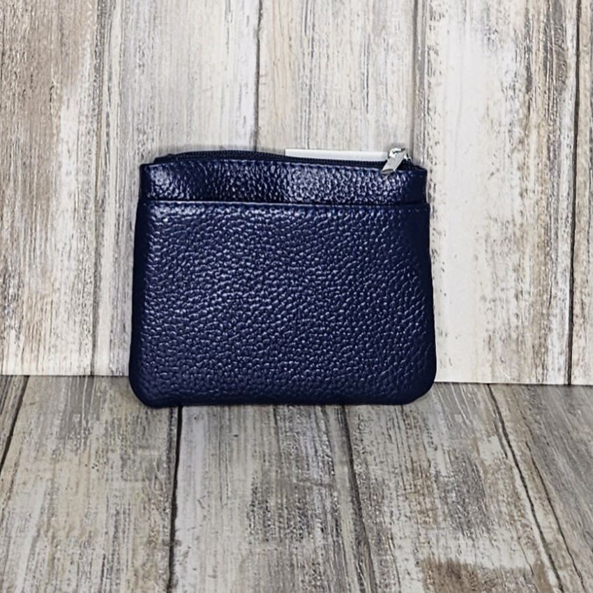 This Leather Zipper Coin Purse is convenient and stylish, featuring two front zip pockets, a back slip pocket, and a top zip pocket for easy access to coins, cards, and keys. Crafted from genuine leather, with a keyring attachment it's a functional and fashionable accessory.  L:11cm x H:9cm