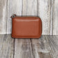 This classic leather card holder features 12 card slots for easy organization. It also includes a single zip and enough space to store a few notes or receipts. Made from premium pebbled leather, it is lightweight yet durable, offering a perfect balance of style and convenience.  L:11cm x W:7cm x D:2.5cm