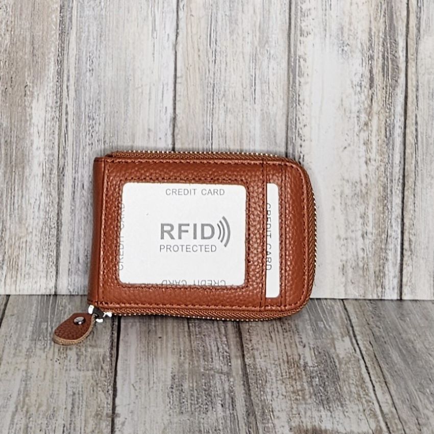 This classic leather card holder features 12 card slots for easy organization. It also includes a single zip and enough space to store a few notes or receipts. Made from premium pebbled leather, it is lightweight yet durable, offering a perfect balance of style and convenience.  L:11cm x W:7cm x D:2.5cm