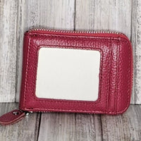 This classic leather card holder features 12 card slots for easy organization. It also includes a single zip and enough space to store a few notes or receipts. Made from premium pebbled leather, it is lightweight yet durable, offering a perfect balance of style and convenience.