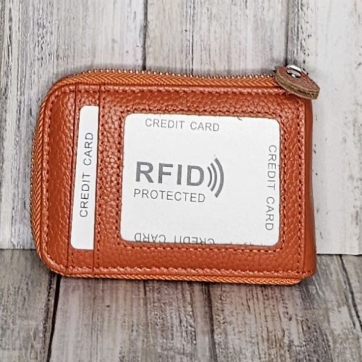 This classic leather card holder features 12 card slots for easy organization. It also includes a single zip and enough space to store a few notes or receipts. Made from premium pebbled leather, it is lightweight yet durable, offering a perfect balance of style and convenience.