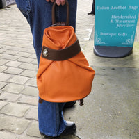 Discover the perfect blend of style and convenience with this Italian leather postman's lock backpack! Its sumptuous, pebbled leather offers timeless sophistication and makes a bold statement wherever you go. Keep your belongings safe and secure with both the postman's lock and zip closure. And with its spacious design, you'll have plenty of room to store your everyday essentials.