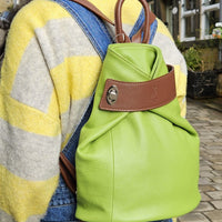 Discover the perfect blend of style and convenience with this Italian leather postman's lock backpack! Its sumptuous, pebbled leather offers timeless sophistication and makes a bold statement wherever you go. Keep your belongings safe and secure with both the postman's lock and zip closure. And with its spacious design, you'll have plenty of room to store your everyday essentials.