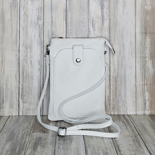 This Italian leather pebbled leather mini bag has it all. It's designed with a phone holder, slick zip closure, and a long cross body detachable and adjustable strap, making it perfect for any occasion. You'll have peace of mind knowing your essentials are safe and secure.