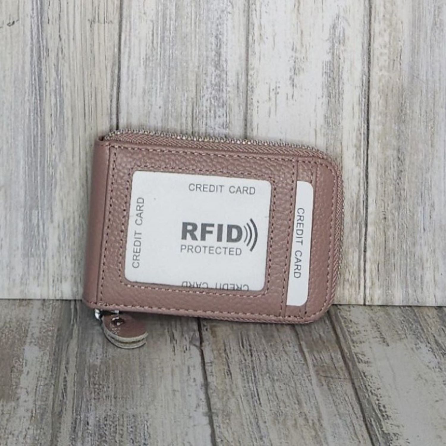This classic leather card holder features 12 card slots for easy organization. It also includes a single zip and enough space to store a few notes or receipts. Made from premium pebbled leather, it is lightweight yet durable, offering a perfect balance of style and convenience.
