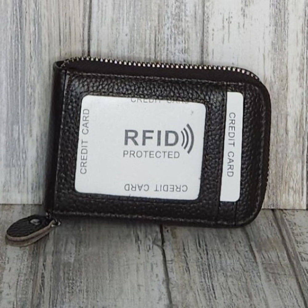 This classic leather card holder features 12 card slots for easy organization. It also includes a single zip and enough space to store a few notes or receipts. Made from premium pebbled leather, it is lightweight yet durable, offering a perfect balance of style and convenience.