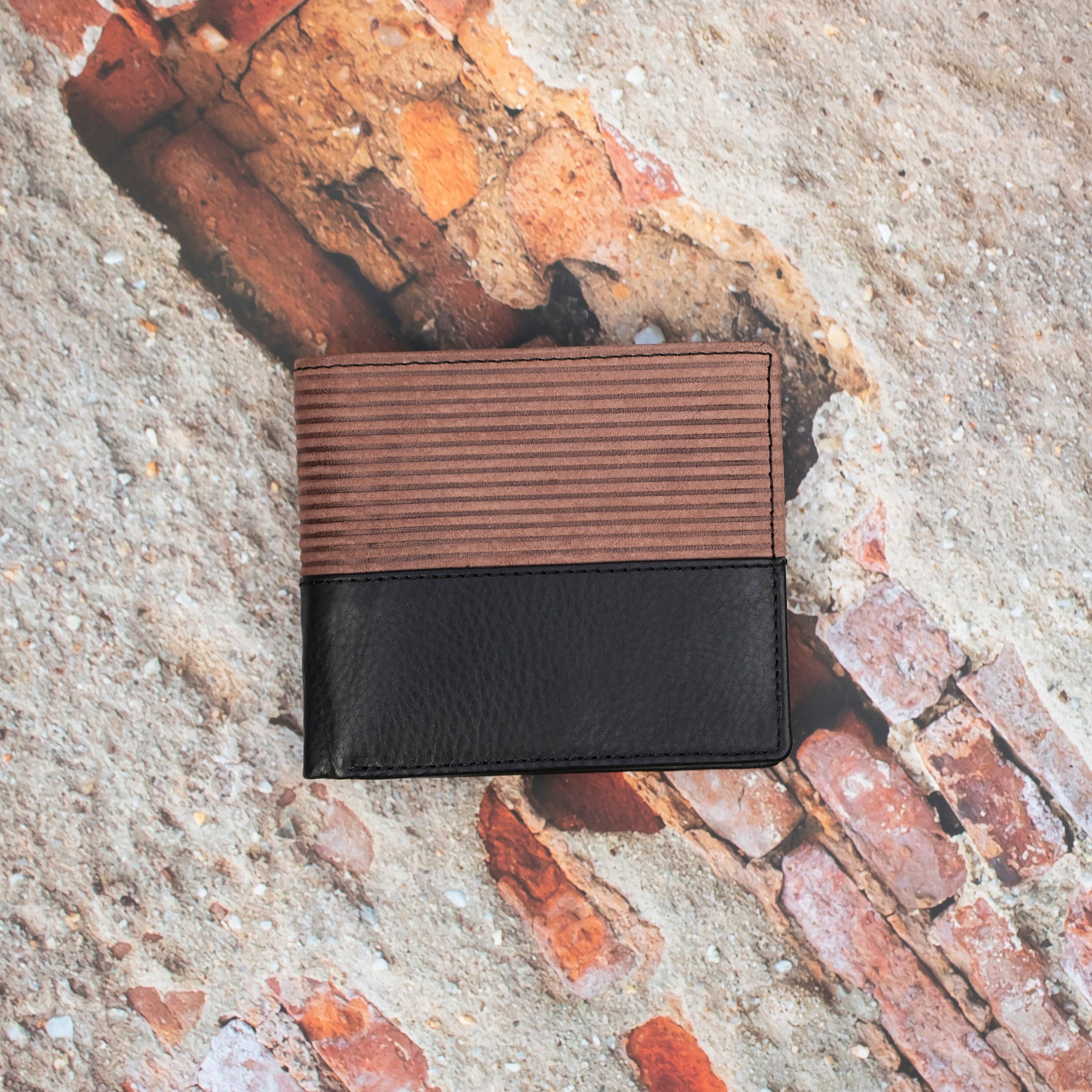 This  Trifold Leather Wallet is designed to maximize protection and organization. Featuring a trifold design with RFID blocking technology, this black and Brown leather wallet has 6 card slots, an ID window, a coin pocket, slip pockets, and 2 note compartments. Keep your personal information secure and organized with this stylish and functional wallet.  12 x 10 cm