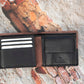 This  Trifold Leather Wallet is designed to maximize protection and organization. Featuring a trifold design with RFID blocking technology, this black and Brown leather wallet has 6 card slots, an ID window, a coin pocket, slip pockets, and 2 note compartments. Keep your personal information secure and organized with this stylish and functional wallet.  12 x 10 cm