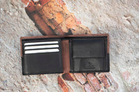 This  Trifold Leather Wallet is designed to maximize protection and organization. Featuring a trifold design with RFID blocking technology, this black and Brown leather wallet has 6 card slots, an ID window, a coin pocket, slip pockets, and 2 note compartments. Keep your personal information secure and organized with this stylish and functional wallet.  12 x 10 cm