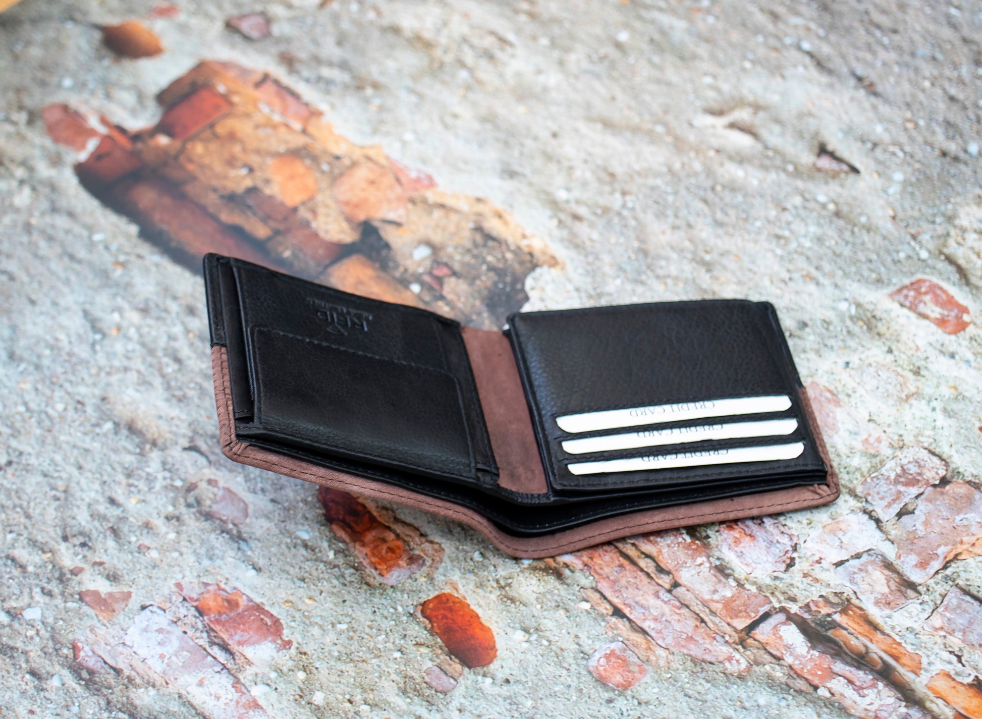 This  Trifold Leather Wallet is designed to maximize protection and organization. Featuring a trifold design with RFID blocking technology, this black and Brown leather wallet has 6 card slots, an ID window, a coin pocket, slip pockets, and 2 note compartments. Keep your personal information secure and organized with this stylish and functional wallet.  12 x 10 cm