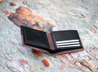 This  Trifold Leather Wallet is designed to maximize protection and organization. Featuring a trifold design with RFID blocking technology, this black and Brown leather wallet has 6 card slots, an ID window, a coin pocket, slip pockets, and 2 note compartments. Keep your personal information secure and organized with this stylish and functional wallet.  12 x 10 cm