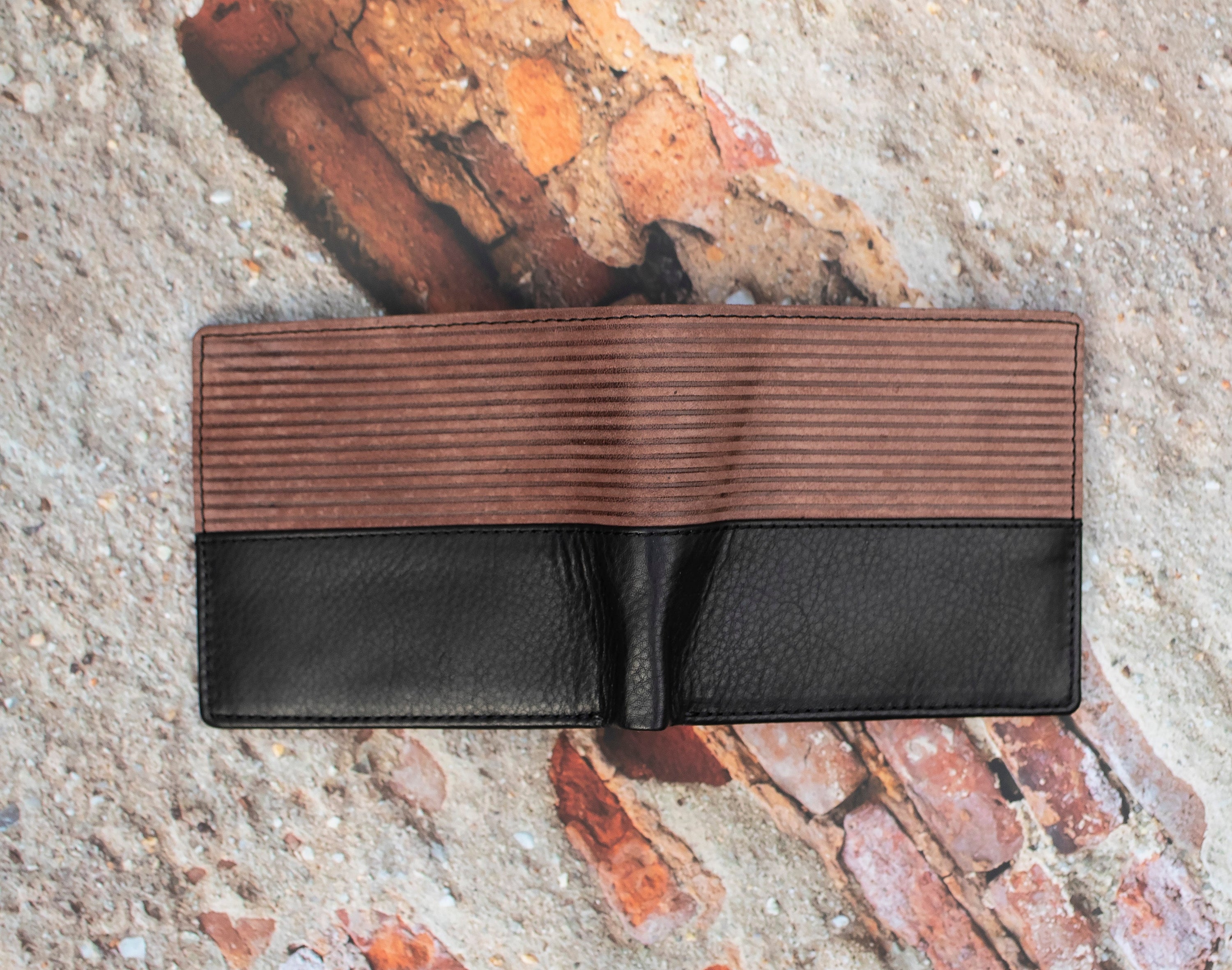 This  Trifold Leather Wallet is designed to maximize protection and organization. Featuring a trifold design with RFID blocking technology, this black and Brown leather wallet has 6 card slots, an ID window, a coin pocket, slip pockets, and 2 note compartments. Keep your personal information secure and organized with this stylish and functional wallet.  12 x 10 cm