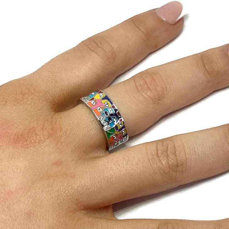 Dress to impress with this stylish unisex band! Its silver-plated steel alloy is adorned with colorful art deco faces, adding fun and flair to any outfit. Make a statement with this unique piece and show the world your inner artist!  Weight: 16g