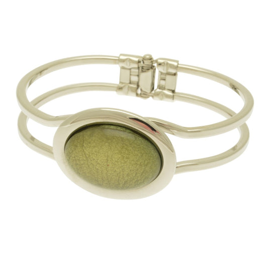 This Green Marble Resin Bracelet embodies a contemporary style with its unique texture and mesmerizing visual effect. This statement piece adds a touch of luxury to any outfit. Its hinged opening ensures a comfortable fit for all wrist sizes.