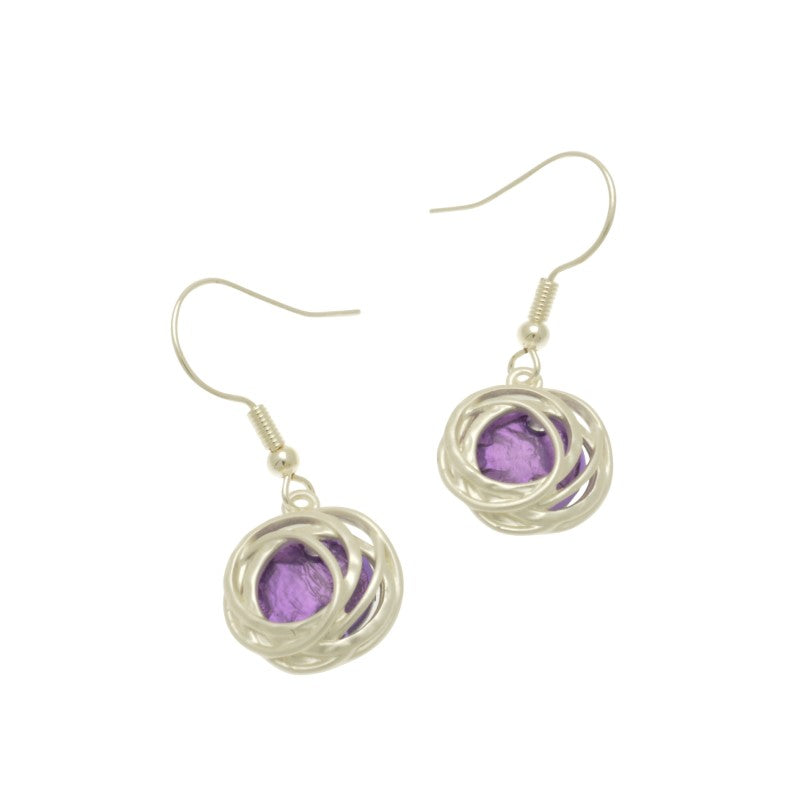 Make a bold statement with the Bright Purple and Silver Drop Earrings! These stunning earrings feature a beautiful bold purple resin backed by aluminium foil and surrounded by matt silver hooped metalwork, creating a unique and captivating blend of color and texture. Be glamorous and daring with these one-of-a-kind earrings!  These earrings are  approx 1.5cm in diameter and hang approx 2cm down from fishhooks.