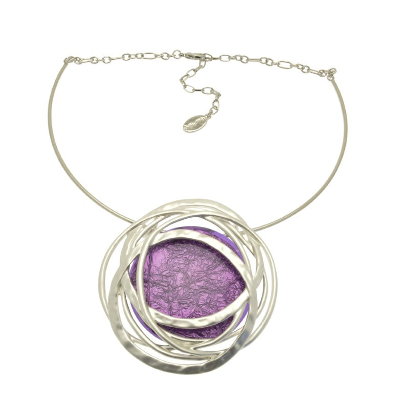 Indulge in luxury with our Purple And Silver Statement Necklace. Featuring a large resin pendant in striking purple and a delicate partial torque chain in matt silver, this necklace is the perfect statement piece for any outfit. Elevate your style with this exclusive and tasteful necklace.