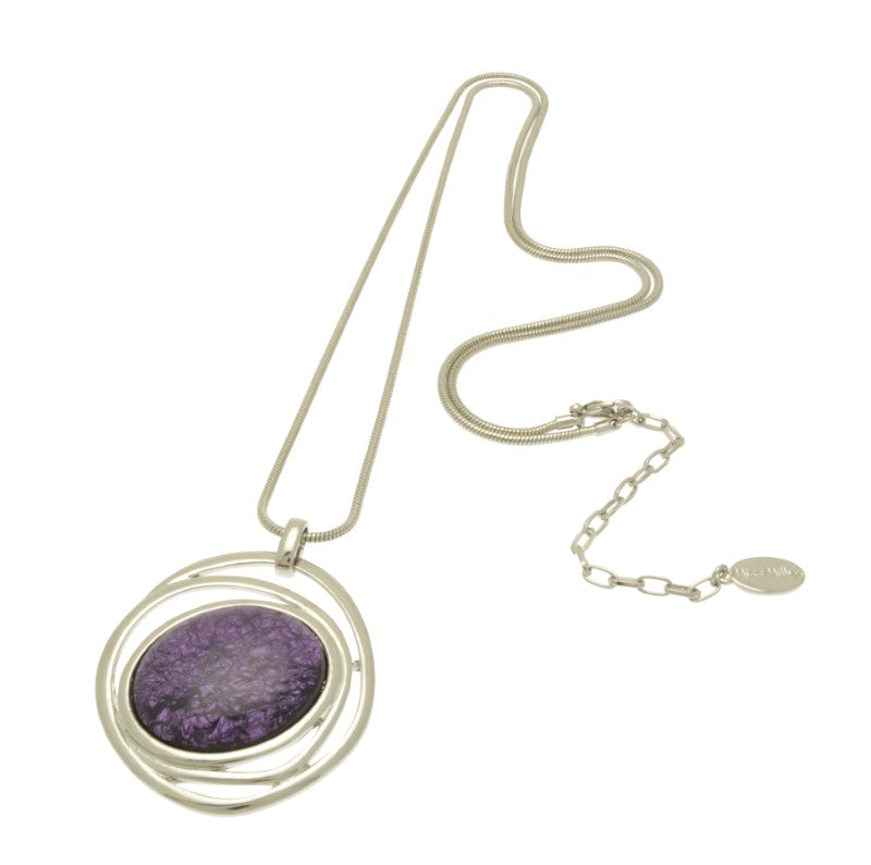 This eye-catching necklace is crafted with luxurious pinky purple resin and a swirl of shiny silver, backed with aluminium foil for added depth and texture. Its unique 5cm by 4.5cm design hangs elegantly from a 75cm snake chain with a 5cm extender for a customised fit.