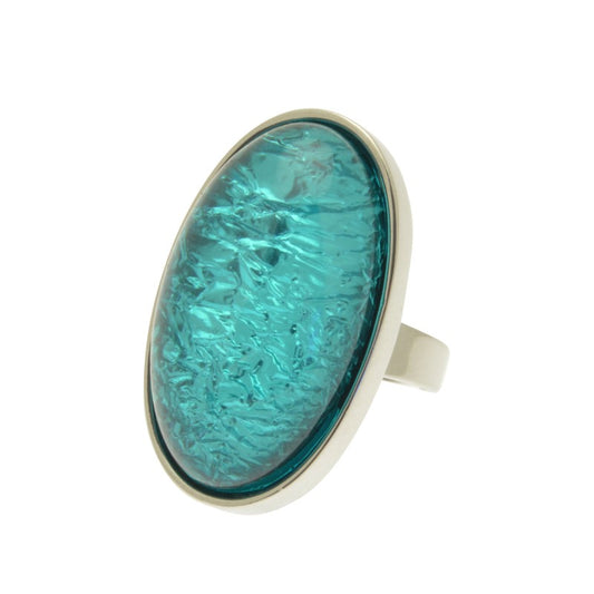 This Chunky Emerald Green Foil Ring is an eye-catching statement piece with a modern twist. Crafted from resin with a shimmery foil backing, its bold but not overpowering design measures 3.3 cm long by 2 cm wide with an adjustable band. Perfect for pairing with other Miss Milly jewellery.