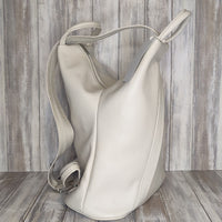 A beautiful soft and lightweight pebbled leather Italian backpack. These versatile backpacks can be carried in three ways, either by the loop handle at the top, over one shoulder, or by unzipping the strap and wearing as a classic backpack. Each bag is fully lined and comes in such a variety of gorgeous colours so you won't have any trouble choosing your favourite!  Front, back and inside pockets.  w25cm x h31cm x d14 cm 