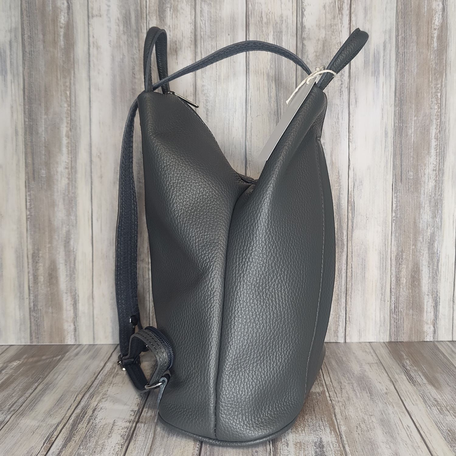 A beautiful soft and lightweight pebbled leather Italian backpack. These versatile backpacks can be carried in three ways, either by the loop handle at the top, over one shoulder, or by unzipping the strap and wearing as a classic backpack. Each bag is fully lined and comes in such a variety of gorgeous colours so you won't have any trouble choosing your favourite!  Front, back and inside pockets.  w25cm x h31cm x d14 cm 