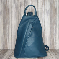 A beautiful soft and lightweight pebbled leather Italian backpack. These versatile backpacks can be carried in three ways, either by the loop handle at the top, over one shoulder, or by unzipping the strap and wearing as a classic backpack. Each bag is fully lined and comes in such a variety of gorgeous colours so you won't have any trouble choosing your favourite!  Front, back and inside pockets.  w25cm x h31cm x d14 cm 