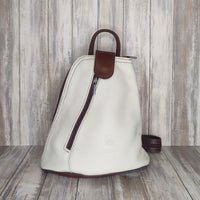 Another beautifully soft and lightweight leather Italian backpack, but this time a smaller version of our large backpack. This small backpack is equally as versatile and can be worn in the same main three ways, either by the loop handle at the top, over one shoulder, or by unzipping the strap and wearing as a classic backpack. You can also unclip the straps of these smaller ones and wear them as a cross body!  Each bag is fully lined with front, back and inside pockets.   w22cm x d23cm x h12cm