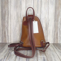 Another beautifully soft and lightweight leather Italian backpack, but this time a smaller version of our large backpack. This small backpack is equally as versatile and can be worn in the same main three ways, either by the loop handle at the top, over one shoulder, or by unzipping the strap and wearing as a classic backpack. You can also unclip the straps of these smaller ones and wear them as a cross body!  Each bag is fully lined with front, back and inside pockets.   w22cm x d23cm x h12cm