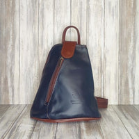 Another beautifully soft and lightweight leather Italian backpack, but this time a smaller version of our large backpack. This small backpack is equally as versatile and can be worn in the same main three ways, either by the loop handle at the top, over one shoulder, or by unzipping the strap and wearing as a classic backpack. You can also unclip the straps of these smaller ones and wear them as a cross body!  Each bag is fully lined with front, back and inside pockets.   w22cm x d23cm x h12cm