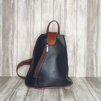 Another beautifully soft and lightweight leather Italian backpack, but this time a smaller version of our large backpack. This small backpack is equally as versatile and can be worn in the same main three ways, either by the loop handle at the top, over one shoulder, or by unzipping the strap and wearing as a classic backpack. You can also unclip the straps of these smaller ones and wear them as a cross body!  Each bag is fully lined with front, back and inside pockets.   w22cm x d23cm x h12cm