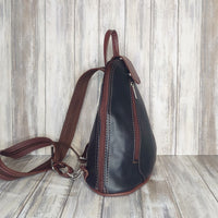 Another beautifully soft and lightweight leather Italian backpack, but this time a smaller version of our large backpack. This small backpack is equally as versatile and can be worn in the same main three ways, either by the loop handle at the top, over one shoulder, or by unzipping the strap and wearing as a classic backpack. You can also unclip the straps of these smaller ones and wear them as a cross body!  Each bag is fully lined with front, back and inside pockets.   w22cm x d23cm x h12cm