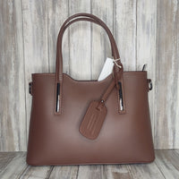 Elevate your style with this stunning Italian leather double compartment handbag.  Its soft yet structured design looks beautiful and feels equally beautiful to wear. This is a classic design that will match with any outfit and is the perfect size for all your essential items. Get ready to make a statement with this fashionable and functional addition to your wardrobe.  We love this bag!