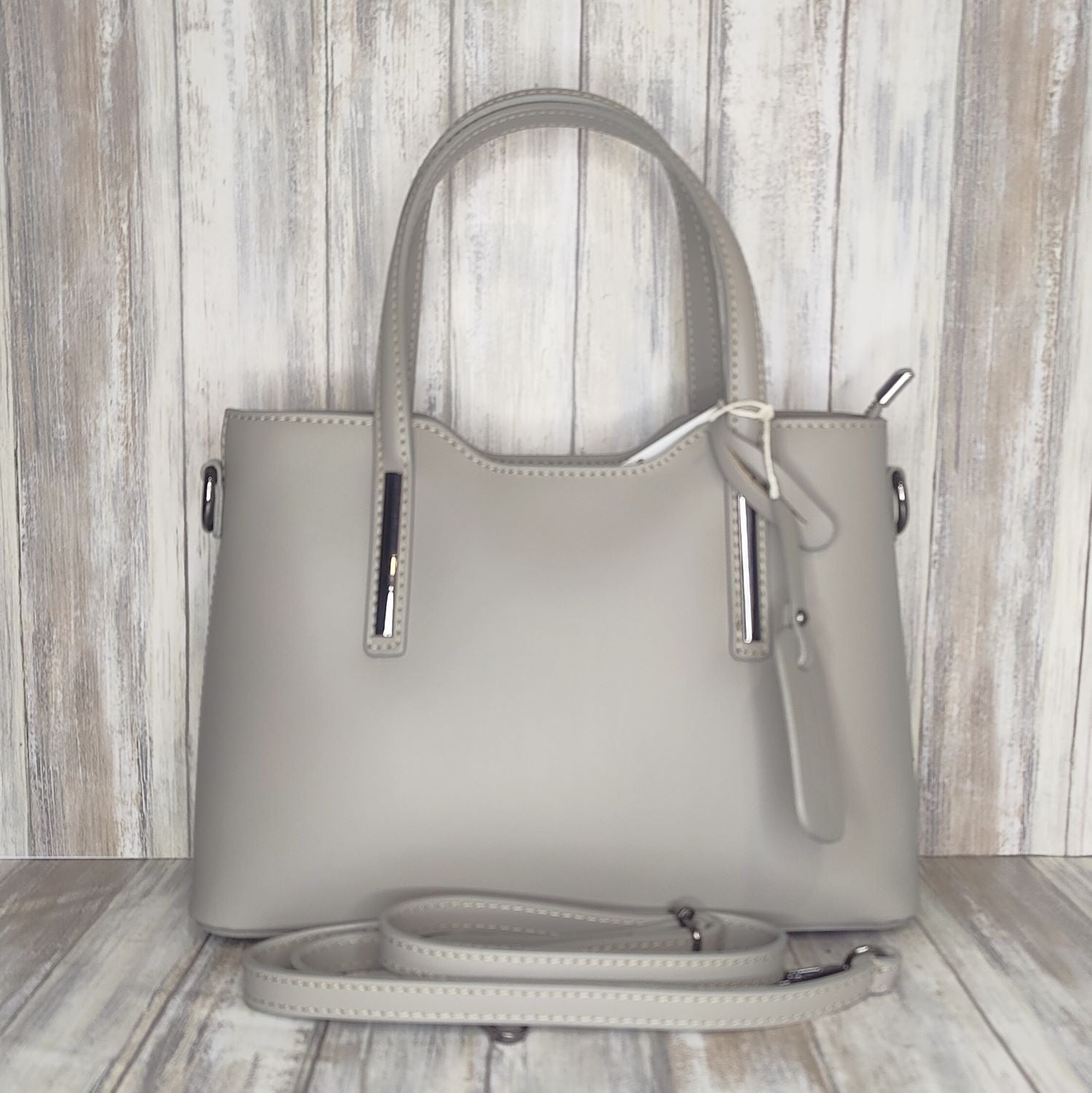 Elevate your style with this stunning Italian leather double compartment handbag.  Its soft yet structured design looks beautiful and feels equally beautiful to wear. This is a classic design that will match with any outfit and is the perfect size for all your essential items. Get ready to make a statement with this fashionable and functional addition to your wardrobe.  We love this bag!