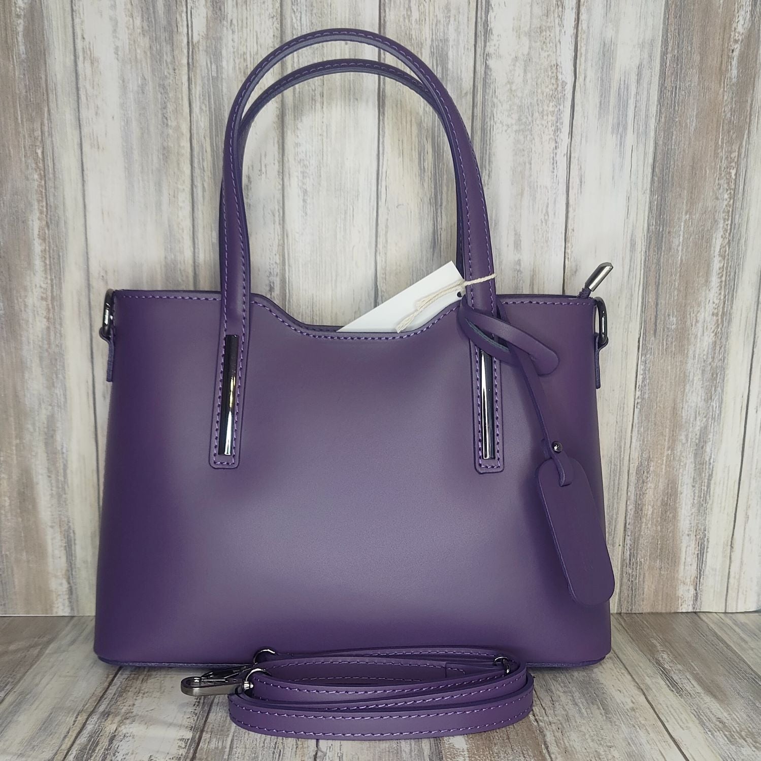 Elevate your style with this stunning Italian leather double compartment handbag.  Its soft yet structured design looks beautiful and feels equally beautiful to wear. This is a classic design that will match with any outfit and is the perfect size for all your essential items. Get ready to make a statement with this fashionable and functional addition to your wardrobe.  We love this bag!