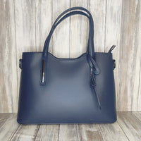 Elevate your style with this stunning Italian leather double compartment handbag.  Its soft yet structured design looks beautiful and feels equally beautiful to wear. This is a classic design that will match with any outfit and is the perfect size for all your essential items. Get ready to make a statement with this fashionable and functional addition to your wardrobe.  We love this bag!