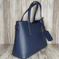 Elevate your style with this stunning Italian leather double compartment handbag.  Its soft yet structured design looks beautiful and feels equally beautiful to wear. This is a classic design that will match with any outfit and is the perfect size for all your essential items. Get ready to make a statement with this fashionable and functional addition to your wardrobe.  We love this bag!