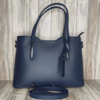 Elevate your style with this stunning Italian leather double compartment handbag.  Its soft yet structured design looks beautiful and feels equally beautiful to wear. This is a classic design that will match with any outfit and is the perfect size for all your essential items. Get ready to make a statement with this fashionable and functional addition to your wardrobe.  We love this bag!