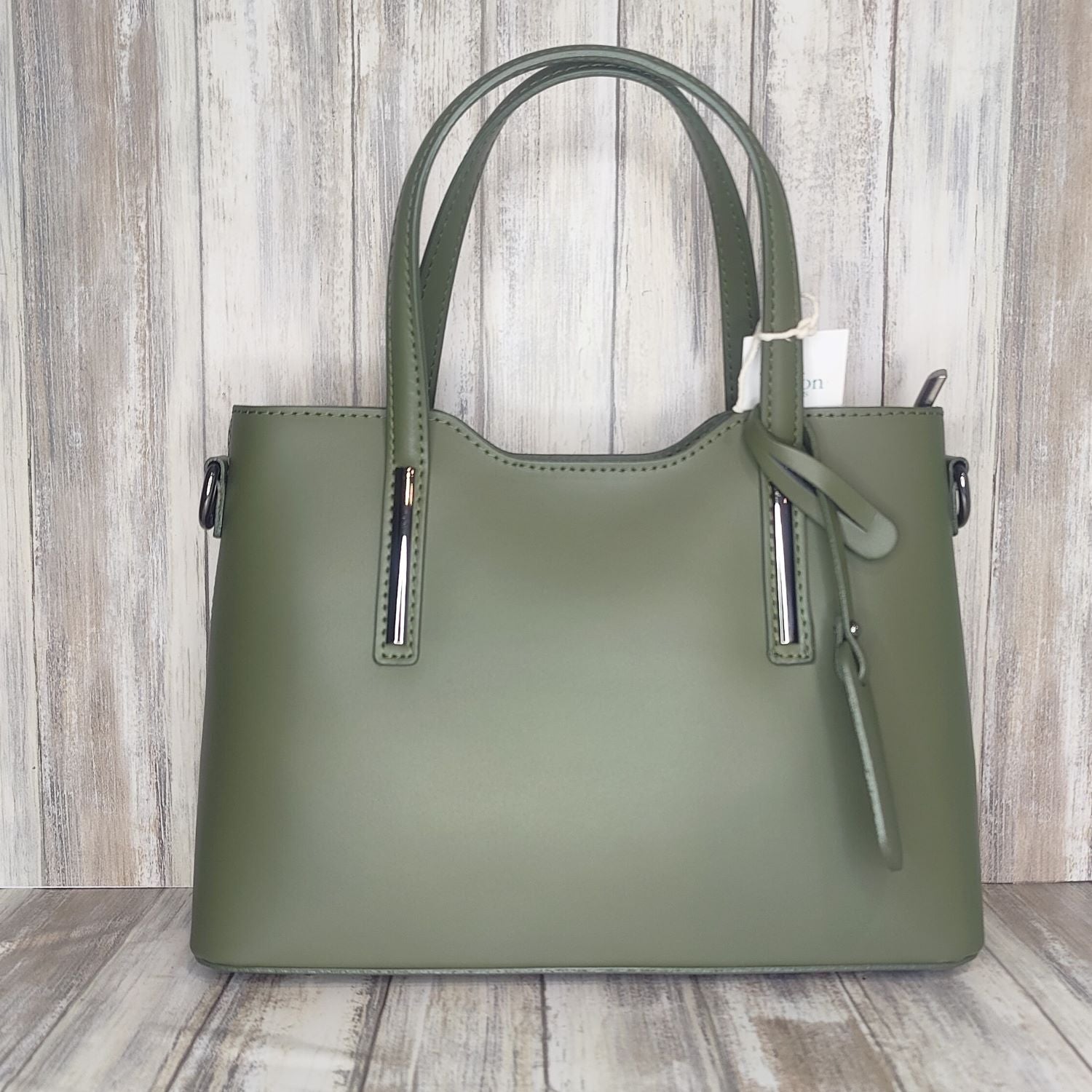 Elevate your style with this stunning Italian leather double compartment handbag.  Its soft yet structured design looks beautiful and feels equally beautiful to wear. This is a classic design that will match with any outfit and is the perfect size for all your essential items. Get ready to make a statement with this fashionable and functional addition to your wardrobe.  We love this bag!