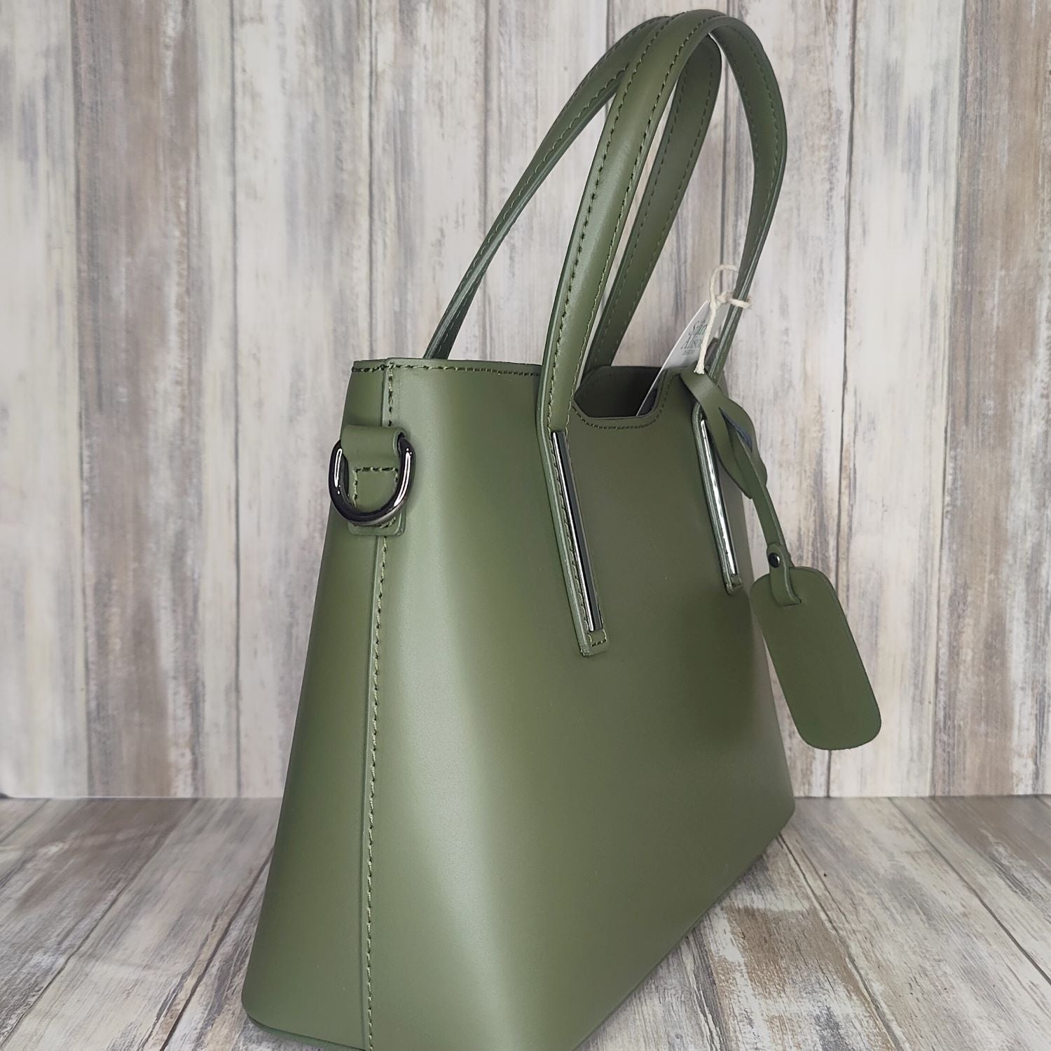 Elevate your style with this stunning Italian leather double compartment handbag.  Its soft yet structured design looks beautiful and feels equally beautiful to wear. This is a classic design that will match with any outfit and is the perfect size for all your essential items. Get ready to make a statement with this fashionable and functional addition to your wardrobe.  We love this bag!